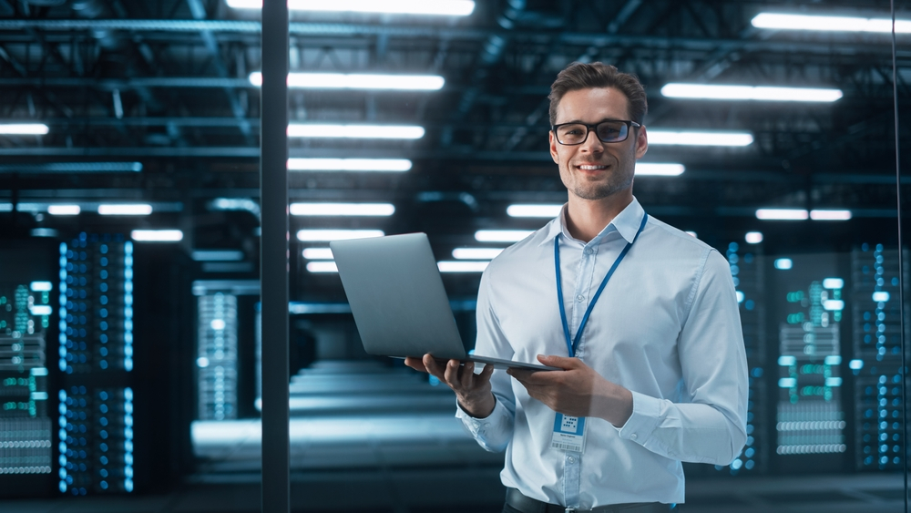 software engineer configuring refurbished servers in a data warehouse